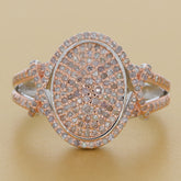 Rose gold and silver ring adorned with sparkling gemstones, showcasing elegance and luxury.
