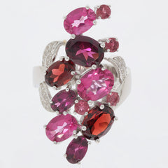 Elegant sterling silver ring adorned with vibrant red and pink gemstones in various cuts.