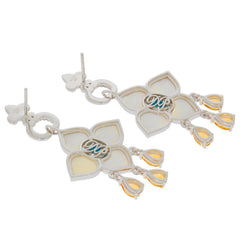 Elegant silver earrings with floral design and gemstone accents, showcasing intricate details and a sophisticated style.