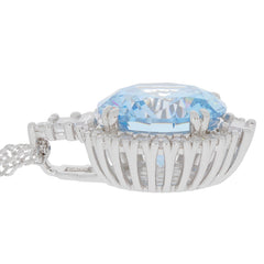 Round blue topaz sterling silver pendant showcasing a sparkling gemstone and elegant design.