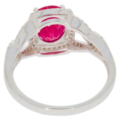 Back view of an elegant oval red ruby sterling silver ring, featuring a large sparkling gemstone.