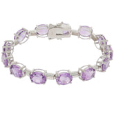 Oval purple amethyst sterling silver bracelet, featuring sparkling gemstones in an elegant design.