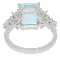 Blue Topaz Sterling Silver Ring showcasing a square cut gemstone, accented by smaller stones for an elegant finish.