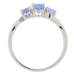 Elegant Oval Blue Tanzanite Sterling Silver Ring with three sparkling gemstones, showcasing timeless luxury and style.