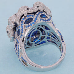 Elegantly designed sterling silver ring featuring blue sapphires and sparkling accents, perfect for luxurious style.