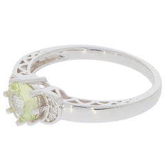 14K white gold ring featuring a stunning green peridot gemstone and diamond accent, showcasing elegant design.