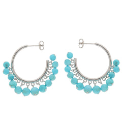 Elegant blue turquoise sterling silver earrings with sparkling gemstone accents, perfect for any sophisticated collection.