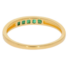 Princess Green Emerald and Gold Ring featuring sparkling gems and a sleek design, perfect for elegant styling.
