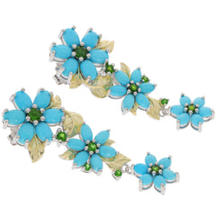 Elegant blue turquoise flower earrings with silver accents and green gemstones, perfect for a sophisticated style.