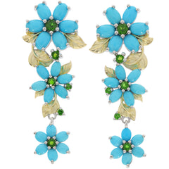 Elegant blue turquoise flower earrings with green accents, crafted in sterling silver, perfect for adding sophistication to any outfit.