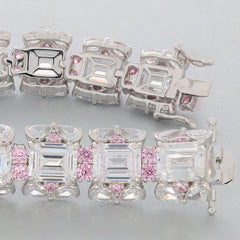 Emerald White Moissanite Sterling Silver Bracelet featuring pink accent gemstones, showcasing elegance and luxury.
