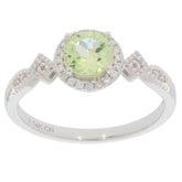 Green Peridot 14K White Gold Ring with Diamond Accent, featuring a round gemstone and intricate band design.