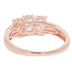 Rose gold side view of an oval pink morganite sterling silver ring with delicate accents.