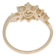 Round green peridot ring with 14K yellow gold setting and sparkling accents, showcasing elegant craftsmanship.