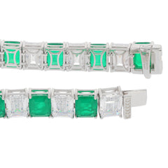 Green Emerald sterling silver bracelet with Moissanite accents, showcasing elegant gemstones in a sophisticated design.