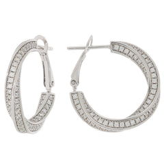 Elegant round white diamond sterling silver earrings with accent stones for a luxurious style.