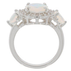 Elegant white opal sterling silver ring featuring three sparkling gemstones, perfect for sophisticated style.