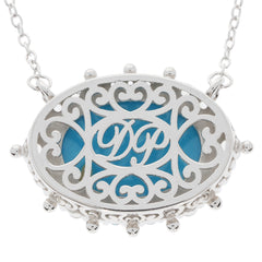 Elegant Oval Blue Turquoise Sterling Silver Necklace with intricate filigree design.