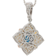 Blue turquoise sterling silver pendant with intricate design, featuring a sparkling gemstone and elegant detailing.