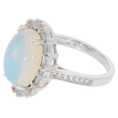 Oval white opal sterling silver ring with sparkling accent stones, perfect for luxurious elegance.