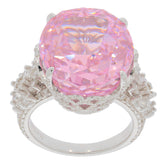 Oval pink sapphire sterling silver ring with intricate accents, radiating elegance and luxury.