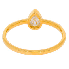 Pear-shaped white diamond ring in gold setting, showcasing elegance and sophistication in jewelry design.
