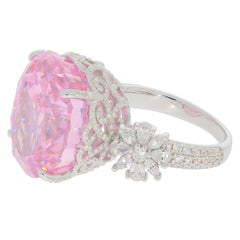 Oval pink sapphire sterling silver ring with accent featuring ornate design and sparkling gemstones.