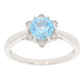 Round blue topaz sterling silver ring with accent stones, elegant design for sophisticated style.