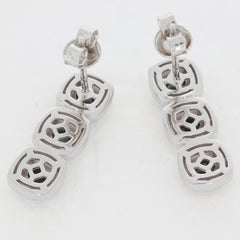 Sterling silver earrings with geometric design, featuring three interlinked square pendants.