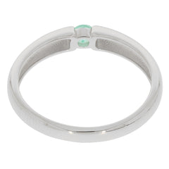 Sterling silver ring showcasing a round green emerald accent, highlighting elegance and sophistication.