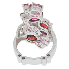 Back view of a lavish Sterling Silver ring featuring multiple pink and red gemstones, showcasing intricate design and elegance.