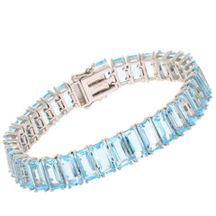 Elegant Emerald Blue Topaz Sterling Silver Bracelet with accent gemstone, showcasing a stunning design.