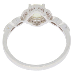 14K white gold ring featuring a green peridot gemstone and diamond accent, showcasing elegant design and craftsmanship.