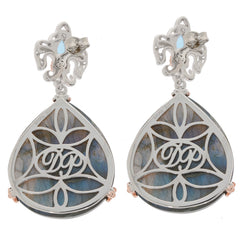 Elegant silver drop earrings with intricate design and labradorite stones, perfect for stylish occasions.