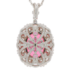 Elegant sterling silver pendant featuring a pink gemstone with intricate floral design and sparkling accents.
