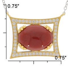Oval red coral sterling silver pendant with accent stones, measuring 0.75 inches, showcasing luxury and elegance.