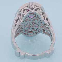 Sterling silver ring with intricate design and purple amethyst accents, showcasing elegance and style.