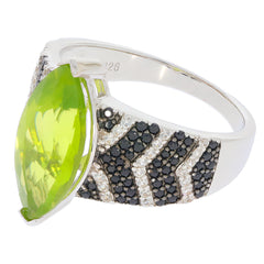 Marquise green peridot sterling silver ring with black accent stones, showcasing elegant design and brilliant gemstone.