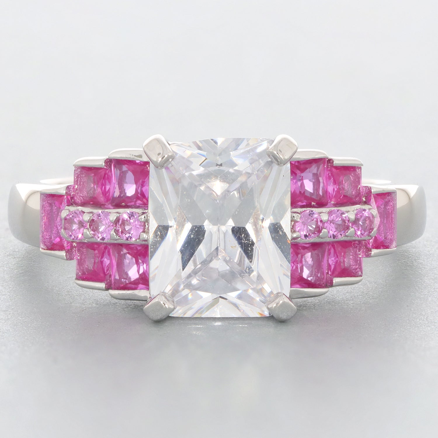 Elegant ring featuring a large clear gemstone with pink accents, perfect for sophisticated style and luxury.