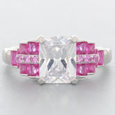 Elegant ring featuring a large clear gemstone with pink accents, perfect for sophisticated style and luxury.