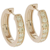 Round hoop earrings in 14K yellow gold with sparkling accent diamonds, perfect for elegant occasions.