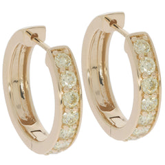 Round hoop earrings in 14K yellow gold with sparkling accent diamonds, perfect for elegant occasions.