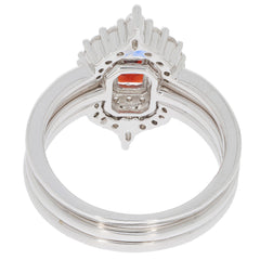 Emerald Red Garnet sterling silver ring with intricate design and sparkling gemstone accent.