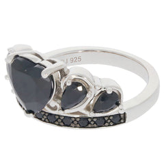 Heart-shaped black spinel sterling silver ring with accent stones, showcasing elegance and timeless beauty.