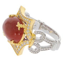 Oval red coral sterling silver ring with accent stones, showcasing elegant design and luxury craftsmanship.