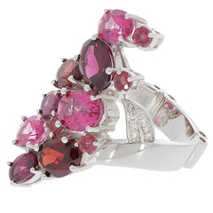 Elegant sterling silver ring adorned with pink and red gemstones, showcasing a stunning design with brilliant accents.