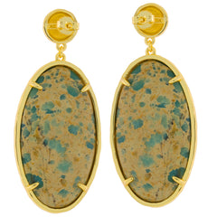 Oval blue turquoise sterling silver earrings with gold accents, showcasing a unique gemstone design.
