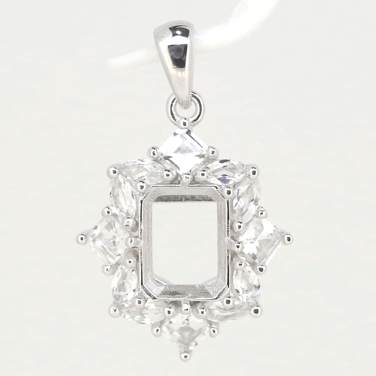Sterling Silver Semi Mount Pendant Setting with 9x7mm empty center for custom gemstones, elegant design.