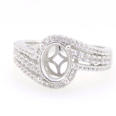 Sterling silver semi mount ring setting with oval 9x7mm space, bypass shank, adorned with white topaz accents.