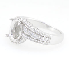Sterling silver semi mount ring setting with halo design, suitable for oval 9x7mm gemstones and white topaz accent.